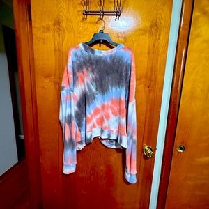 Tie dye sweater piece with open back.
